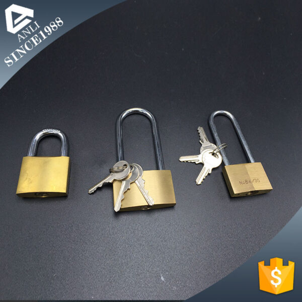 High-security brass padlocks with keys on black background.