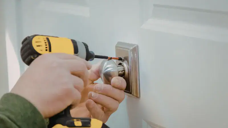 Rekeying a lock with a screwdriver and keyhole.