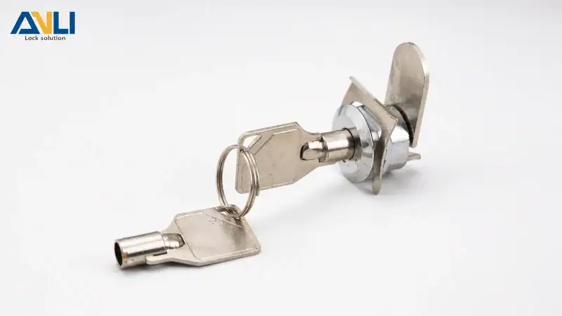 Close-up of an ANLI lock with a key and mounting plate, showcasing durable metal construction for security applications.